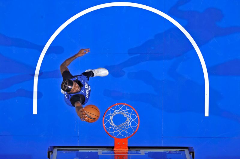 ORLANDO, FL - OCTOBER 25: Kentavious Caldwell-Pope #3 of the Orlando Magic drives to the basket during the game against the Brooklyn Nets on October 25, 2024 at Kia Center in Orlando, Florida. NOTE TO USER: User expressly acknowledges and agrees that, by downloading and or using this photograph, User is consenting to the terms and conditions of the Getty Images License Agreement. Mandatory Copyright Notice: Copyright 2024 NBAE (Photo by Fernando Medina/NBAE via Getty Images)