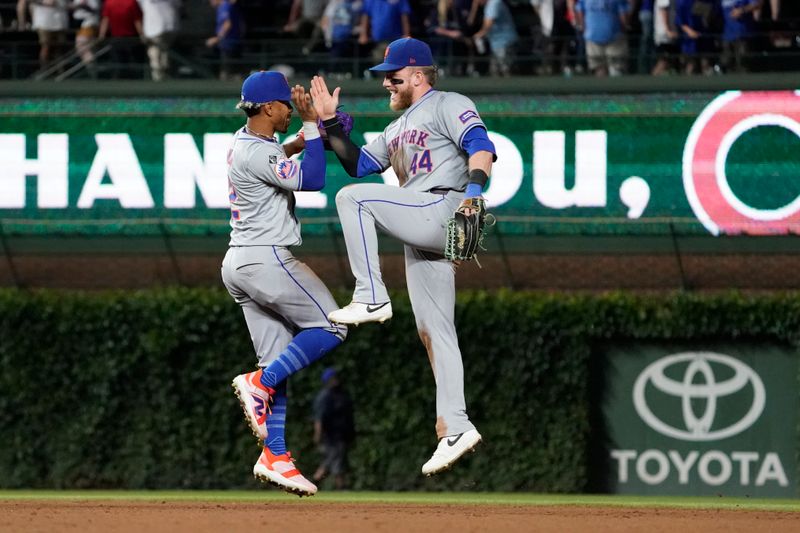 Jun 23, 2024; Chicago, Illinois, USA; New York Mets shortstop Francisco Lindor (12) and outfielder Harrison Bader (44) celebrate their win against the Chicago Cubs at Wrigley Field. Mandatory Credit: David Banks-USA TODAY Sports