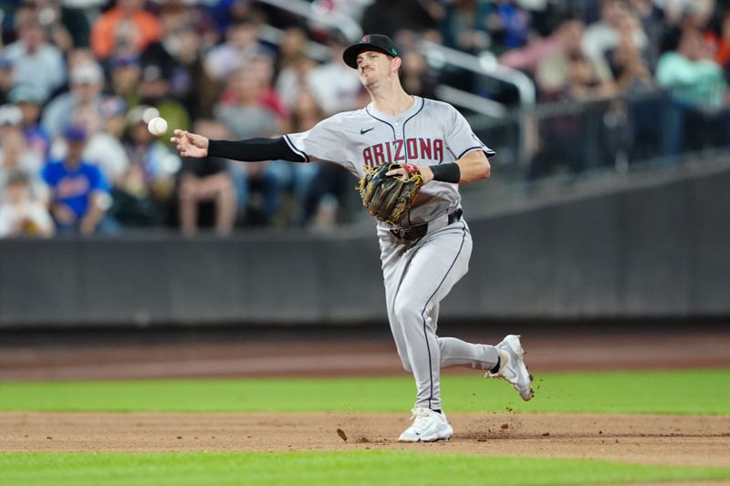 May 31, 2024; New York City, New York, USA; Arizona Diamondbacks shortstop Kevin Newman (18) throws out New York Mets shortstop Francisco Lindor (not pictured) during the seventh inning at Citi Field. Mandatory Credit: Gregory Fisher-USA TODAY Sports