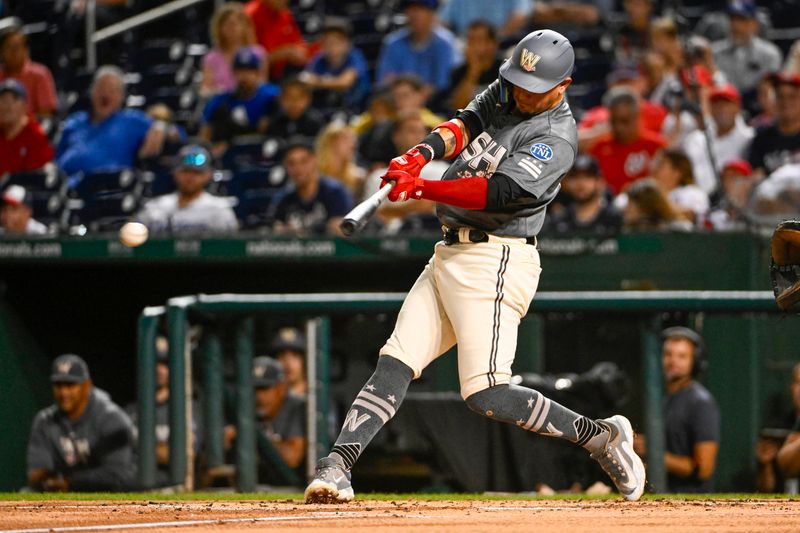 Sep 9, 2023; Washington, District of Columbia, USA; Washington Nationals shortstop Ildemaro Vargas (14) singles against the Los Angeles Dodgers during the second inning at Nationals Park. Mandatory Credit: Brad Mills-USA TODAY Sports