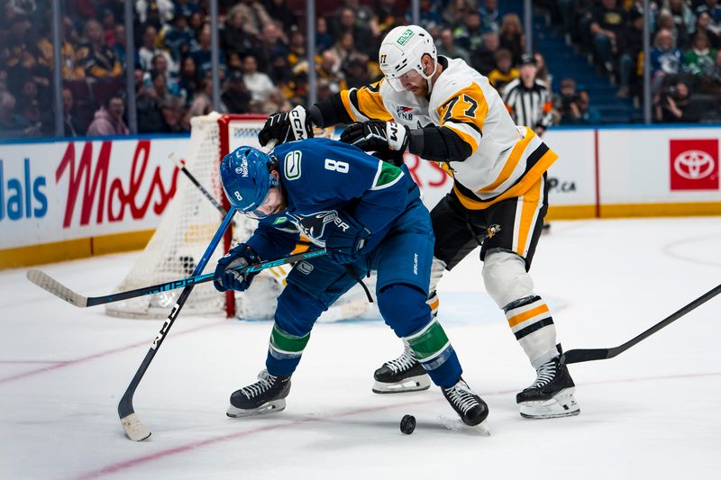 Jan 25, 2026; Vancouver, British Columbia, CAN; Pittsburgh Penguins defenseman Brett Kulak (77) battles with Vancouver Canucks forward Conor Garland (8) in the second period at Rogers Arena. Mandatory Credit: Bob Frid-Imagn Images