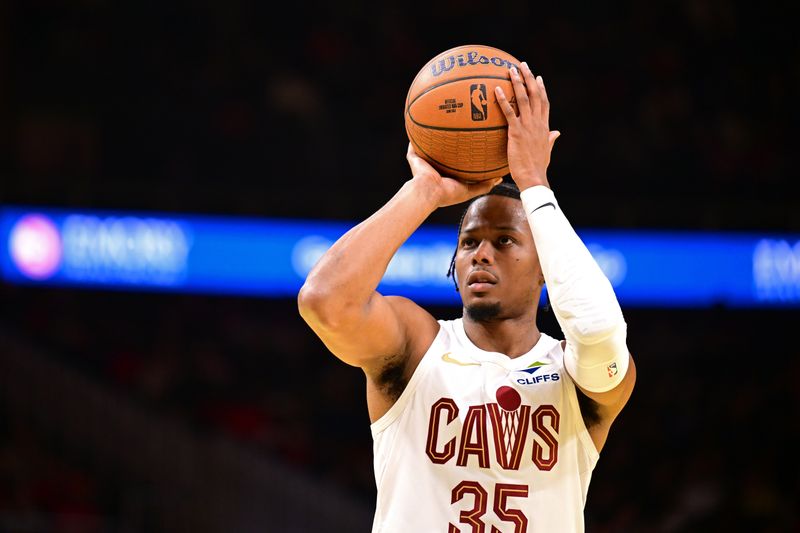 ATLANTA, GA - NOVEMBER 29: Isaac Okoro #35 of the Cleveland Cavaliers shoots a free throw during the game against the Atlanta Hawks during the Emirates NBA Cup game on November 29, 2024 at State Farm Arena in Atlanta, Georgia.  NOTE TO USER: User expressly acknowledges and agrees that, by downloading and/or using this Photograph, user is consenting to the terms and conditions of the Getty Images License Agreement. Mandatory Copyright Notice: Copyright 2024 NBAE (Photo by Adam Hagy/NBAE via Getty Images)