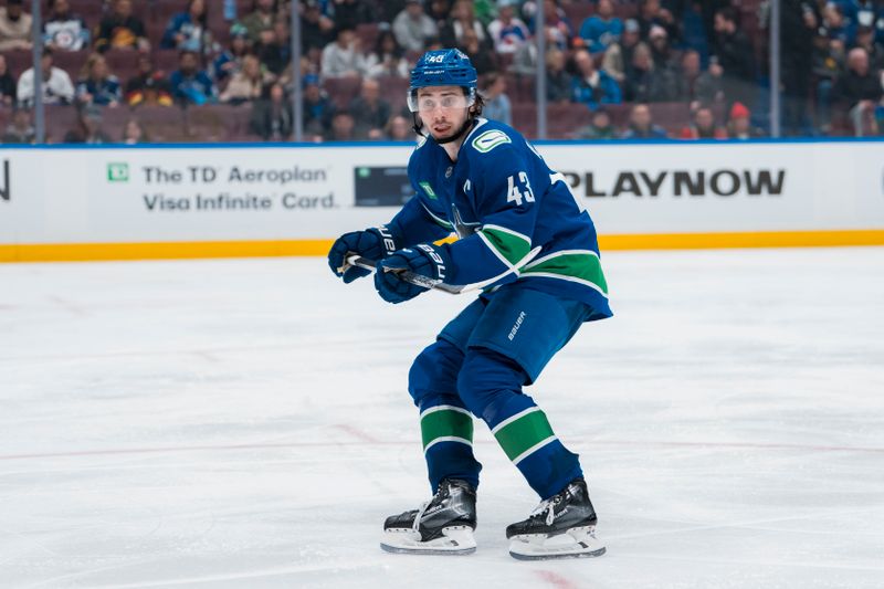 Mar 18, 2025; Vancouver, British Columbia, CAN; Vancouver Canucks defenseman Quinn Hughes (43) skates against the Winnipeg Jets in the third period at Rogers Arena. Mandatory Credit: Bob Frid-Imagn Images