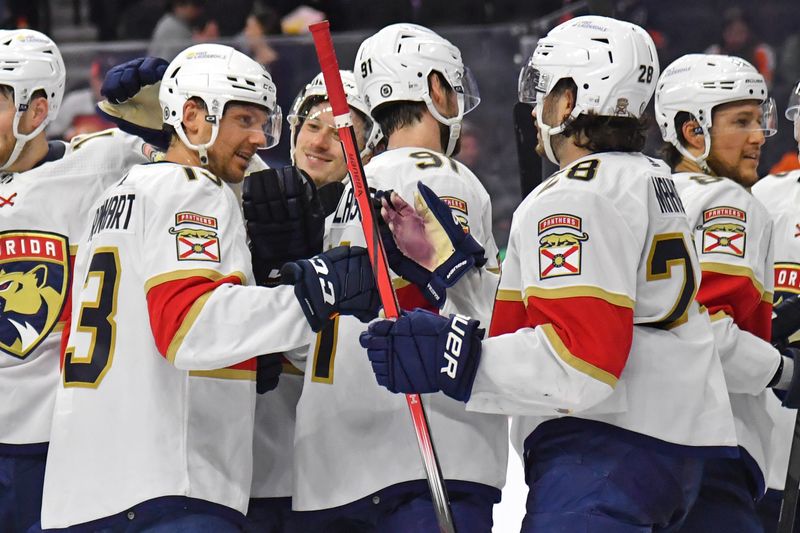 Mar 24, 2024; Philadelphia, Pennsylvania, USA; Florida Panthers center Sam Reinhart (13) celebrates win with teammates against the Philadelphia Flyers at Wells Fargo Center. Mandatory Credit: Eric Hartline-USA TODAY Sports