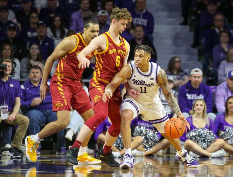 Feb 18, 2023; Manhattan, Kansas, USA; Kansas State Wildcats guard Keyontae Johnson (11) dribbles against Iowa State Cyclones forward Aljaz Kunc (5) during the first half at Bramlage Coliseum. Mandatory Credit: Scott Sewell-USA TODAY Sports