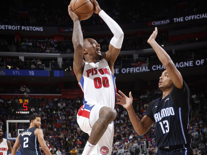 DETROIT, MI - January 01:  Ron Holland II #00 of the Detroit Pistons shoots the ball during the game against the Orlando Magic on January 01, 2025 at Little Caesars Arena in Detroit, Michigan. NOTE TO USER: User expressly acknowledges and agrees that, by downloading and/or using this photograph, User is consenting to the terms and conditions of the Getty Images License Agreement. Mandatory Copyright Notice: Copyright 2025 NBAE (Photo by Brian Sevald/NBAE via Getty Images)