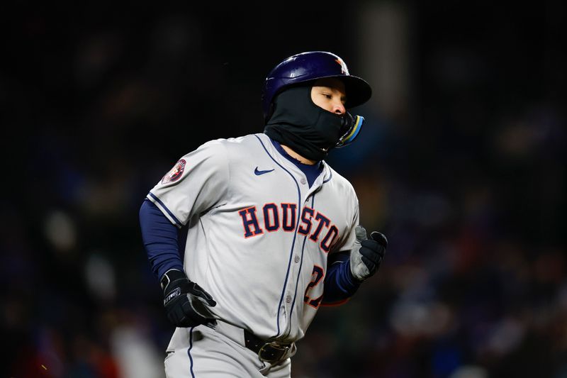 Apr 24, 2024; Chicago, Illinois, USA; Houston Astros second baseman Jose Altuve (27) rounds the bases after hitting a solo home run against the Chicago Cubs during the ninth inning at Wrigley Field. Mandatory Credit: Kamil Krzaczynski-USA TODAY Sports
