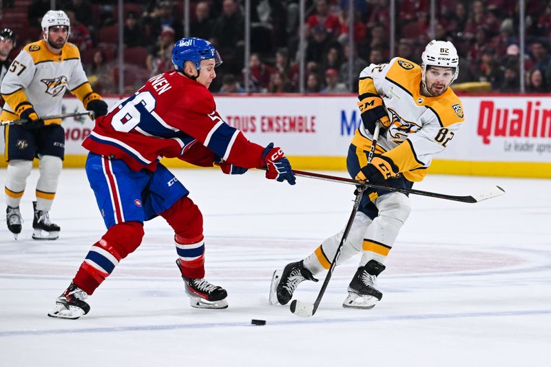 Dec 10, 2023; Montreal, Quebec, CAN; Nashville Predators center Tommy Novak (82) plays the puck against Montreal Canadiens right wing Jesse Ylonen (56) during the second period at Bell Centre. Mandatory Credit: David Kirouac-USA TODAY Sports