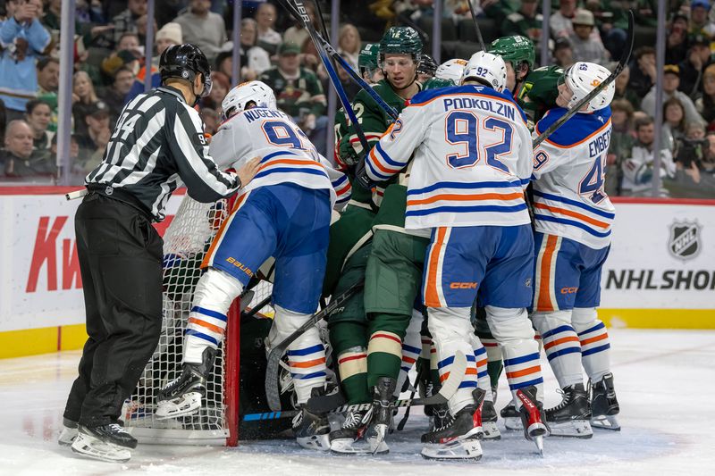 Jan 15, 2025; Saint Paul, Minnesota, USA;  A melee ensues after a goal by Edmonton Oilers defenseman Darnell Nurse (25) against the Minnesota Wild during the third period at Xcel Energy Center. Mandatory Credit: Nick Wosika-Imagn Images

