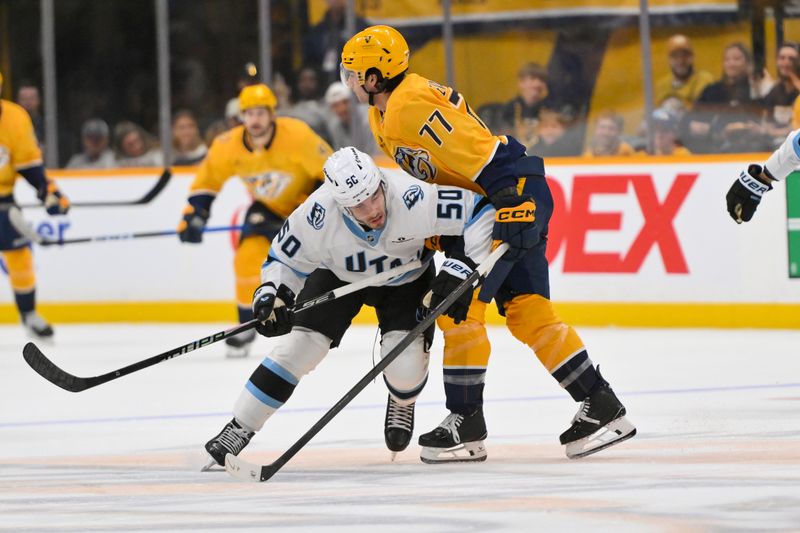 Oct 11, 2025; Nashville, Tennessee, USA;  Utah Mammoth defenseman Sean Durzi (50) checks Nashville Predators right wing Luke Evangelista (77) during the third period at Bridgestone Arena. Mandatory Credit: Steve Roberts-Imagn Images