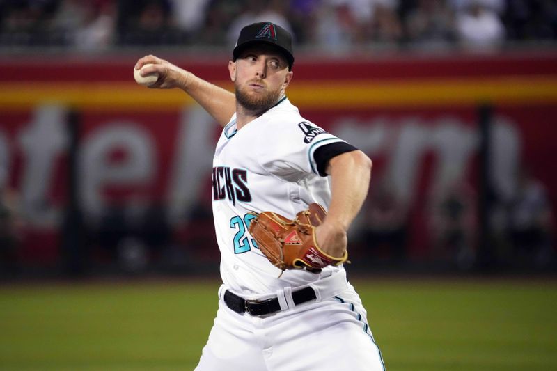 Jul 30, 2023; Phoenix, Arizona, USA; Arizona Diamondbacks starting pitcher Merrill Kelly (29) pitches against the Seattle Mariners during the first inning at Chase Field. Mandatory Credit: Joe Camporeale-USA TODAY Sports