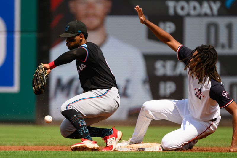 Sep 15, 2024; Washington, District of Columbia, USA; Washington Nationals left fielder James Wood (29) steals second base in front of Miami Marlins second baseman Otto Lopez (61) during the first inning at Nationals Park. Mandatory Credit: Rafael Suanes-Imagn Images