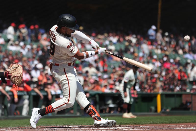 Sep 13, 2023; San Francisco, California, USA; San Francisco Giants center fielder Luis Matos (29) hits an RBI double during the first inning against the Cleveland Guardians at Oracle Park. Mandatory Credit: Sergio Estrada-USA TODAY Sports