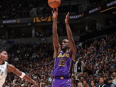 MINNEAPOLIS, MN -  DECEMBER 30: Taurean Prince #12 of the Los Angeles Lakers three point basket during the game against the Minnesota Timberwolves on December 30, 2023 at Target Center in Minneapolis, Minnesota. NOTE TO USER: User expressly acknowledges and agrees that, by downloading and or using this Photograph, user is consenting to the terms and conditions of the Getty Images License Agreement. Mandatory Copyright Notice: Copyright 2023 NBAE (Photo by David Sherman/NBAE via Getty Images)