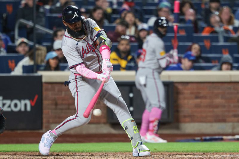 May 12, 2024; New York City, New York, USA; Atlanta Braves designated hitter Marcell Ozuna (20) hits an RBI single during the sixth inning against the New York Mets at Citi Field. Mandatory Credit: Vincent Carchietta-USA TODAY Sports