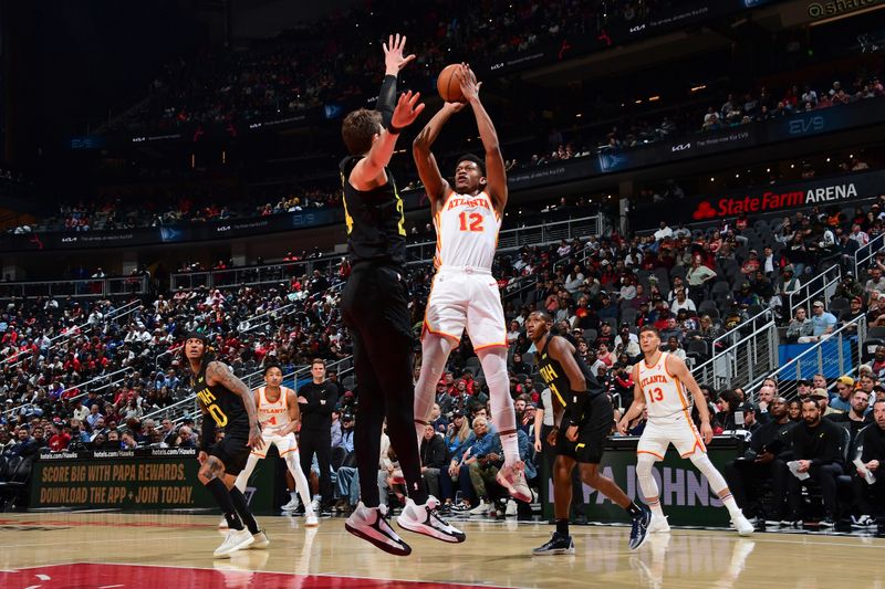 ATLANTA, GA - FEBRUARY 27: De'Andre Hunter #12 of the Atlanta Hawks shoots the ball during the game against the Utah Jazz on February 27, 2024 at State Farm Arena in Atlanta, Georgia.  NOTE TO USER: User expressly acknowledges and agrees that, by downloading and/or using this Photograph, user is consenting to the terms and conditions of the Getty Images License Agreement. Mandatory Copyright Notice: Copyright 2024 NBAE (Photo by Scott Cunningham/NBAE via Getty Images)