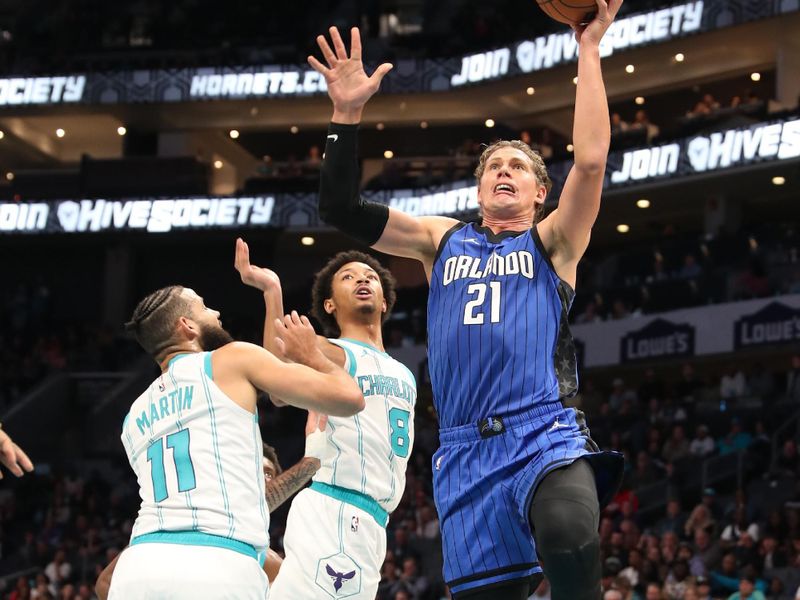 CHARLOTTE, NC -NOVEMBER 25: Moritz Wagner #21 of the Orlando Magic shoots the ball  during the game against the Charlotte Hornets on November 25, 2024 at Spectrum Center in Charlotte, North Carolina. NOTE TO USER: User expressly acknowledges and agrees that, by downloading and or using this photograph, User is consenting to the terms and conditions of the Getty Images License Agreement. Mandatory Copyright Notice: Copyright 2024 NBAE (Photo by Brock Williams-Smith/NBAE via Getty Images)