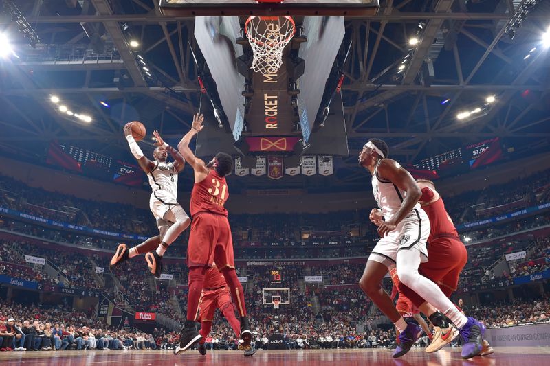 CLEVELAND, OH - MARCH 10: Lonnie Walker IV #8 of the Brooklyn Nets drives to the basket during the game against the Cleveland Cavaliers on March 10, 2024 at Rocket Mortgage FieldHouse in Cleveland, Ohio. NOTE TO USER: User expressly acknowledges and agrees that, by downloading and/or using this Photograph, user is consenting to the terms and conditions of the Getty Images License Agreement. Mandatory Copyright Notice: Copyright 2024 NBAE (Photo by David Liam Kyle/NBAE via Getty Images)