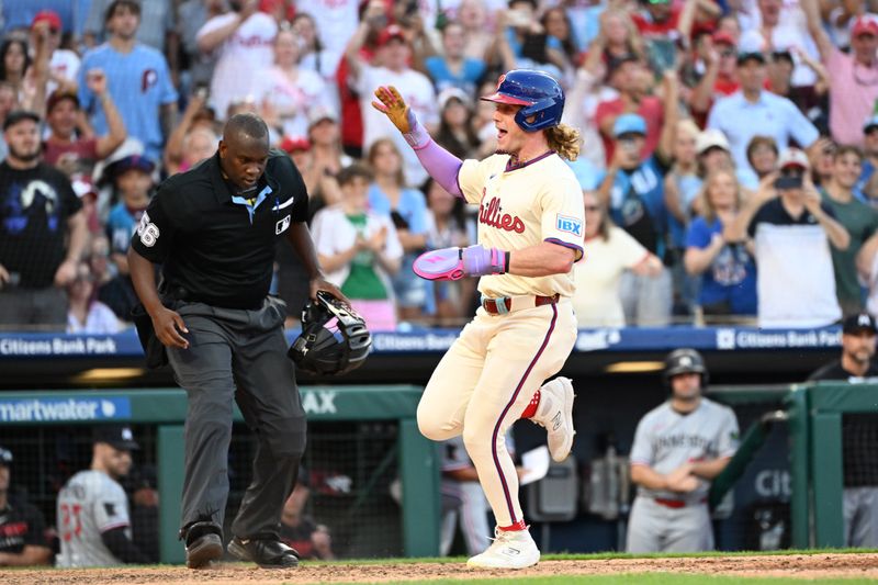 Sep 28, 2025; Philadelphia, Pennsylvania, USA; Philadelphia Phillies outfielder Harrison Bader (2) scores the game-winning run during the tenth inning against the Minnesota Twins at Citizens Bank Park. Mandatory Credit: Eric Hartline-Imagn Images