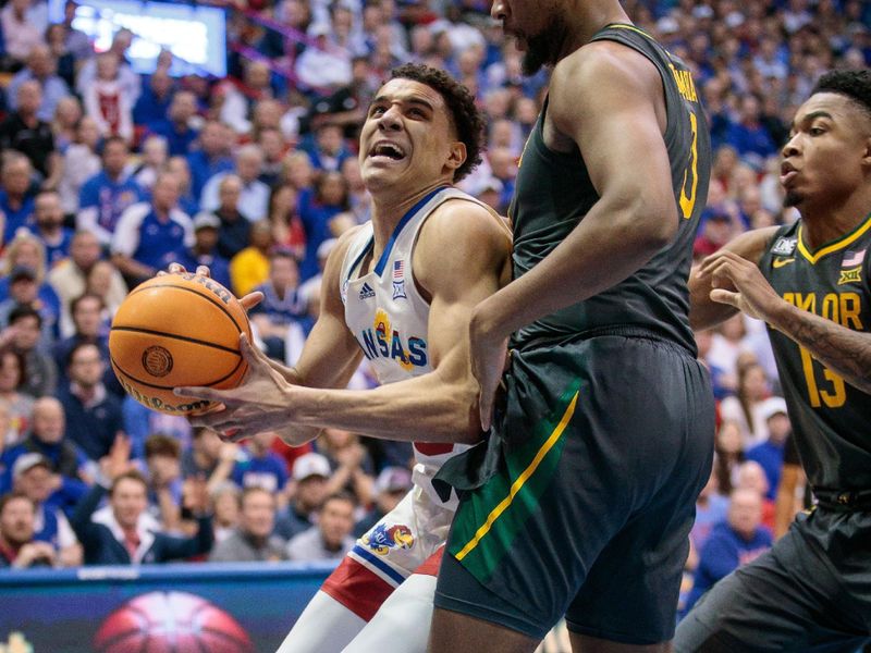 Feb 18, 2023; Lawrence, Kansas, USA; Kansas Jayhawks guard Kevin McCullar Jr. (15) drives against Baylor Bears guard Dale Bonner (3) under the basket during the second half at Allen Fieldhouse. Mandatory Credit: William Purnell-USA TODAY Sports