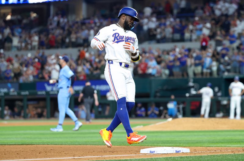 Sep 18, 2024; Arlington, Texas, USA;  Texas Rangers right fielder Adolis Garcia (53) runs the bases after hitting a two-run home run during the sixth inning against the Toronto Blue Jays at Globe Life Field. Mandatory Credit: Kevin Jairaj-Imagn Images