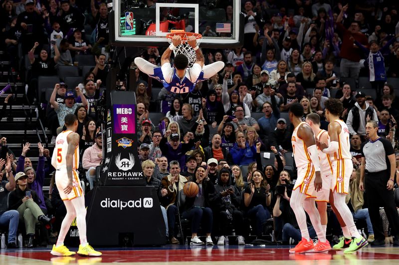 SACRAMENTO, CALIFORNIA - JANUARY 22: JaVale McGee #00 of the Sacramento Kings dunks the ball on the Atlanta Hawks in the second half at Golden 1 Center on January 22, 2024 in Sacramento, California. NOTE TO USER: User expressly acknowledges and agrees that, by downloading and or using this photograph, User is consenting to the terms and conditions of the Getty Images License Agreement.  (Photo by Ezra Shaw/Getty Images)