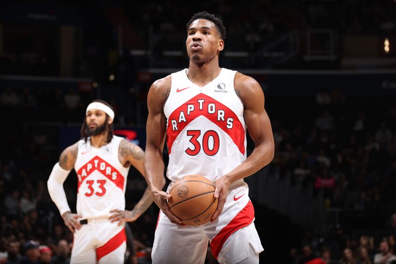 WASHINGTON, DC -? MARCH 23: Ochai Agbaji #30 of the Toronto Raptors shoots a free throw during the game on March 23, 2024 at Capital One Arena in Washington, DC. NOTE TO USER: User expressly acknowledges and agrees that, by downloading and or using this Photograph, user is consenting to the terms and conditions of the Getty Images License Agreement. Mandatory Copyright Notice: Copyright 2024 NBAE (Photo by Stephen Gosling/NBAE via Getty Images)