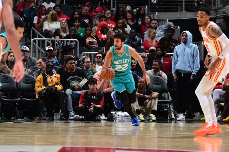 ATLANTA, GA - MARCH 23: Vasilije Micic #22 of the Charlotte Hornets  dribbles the ball during the game against the Atlanta Hawks on March 23, 2024 at State Farm Arena in Atlanta, Georgia.  NOTE TO USER: User expressly acknowledges and agrees that, by downloading and/or using this Photograph, user is consenting to the terms and conditions of the Getty Images License Agreement. Mandatory Copyright Notice: Copyright 2024 NBAE (Photo by Scott Cunningham/NBAE via Getty Images)