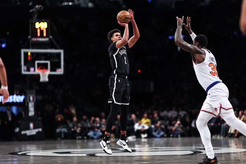 NEW YORK, NEW YORK - JANUARY 23: Cameron Johnson #2 of the Brooklyn Nets attempts a three pointer during the first quarter of the game against the New York Knicks at Barclays Center on January 23, 2024 in New York City.  NOTE TO USER: User expressly acknowledges and agrees that, by downloading and or using this photograph, User is consenting to the terms and conditions of the Getty Images License Agreement. (Photo by Dustin Satloff/Getty Images)