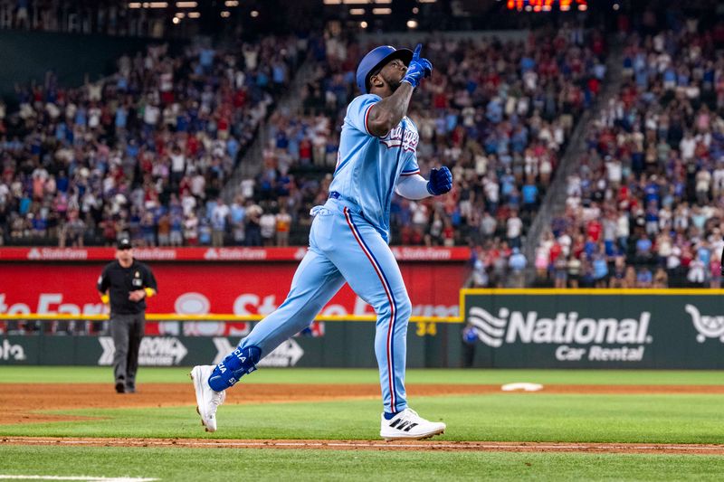 Sep 3, 2023; Arlington, Texas, USA; Texas Rangers right fielder Adolis Garcia (53) celebrates as he rounds the bases after he hits a walk off home run for the win over the Minnesota Twins during the ninth inning at Globe Life Field. Mandatory Credit: Jerome Miron-USA TODAY Sports