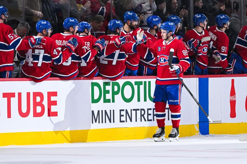 Jan 8, 2026; Montreal, Quebec, CAN; Montreal Canadiens left wing Alexandre Texier (85) celebrates with his teammates at the bench his goal against the Florida Panthers during the second period at Bell Centre. Mandatory Credit: David Kirouac-Imagn Images