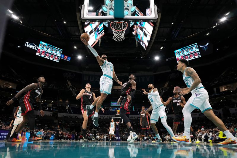 CHARLOTTE, NORTH CAROLINA - OCTOBER 08: Miles Bridges #0 of the Charlotte Hornets goes to the basket against the Miami Heat during the first half of the preseason game at Spectrum Center on October 08, 2024 in Charlotte, North Carolina. NOTE TO USER: User expressly acknowledges and agrees that, by downloading and or using this photograph, User is consenting to the terms and conditions of the Getty Images License Agreement. (Photo by Grant Halverson/Getty Images)