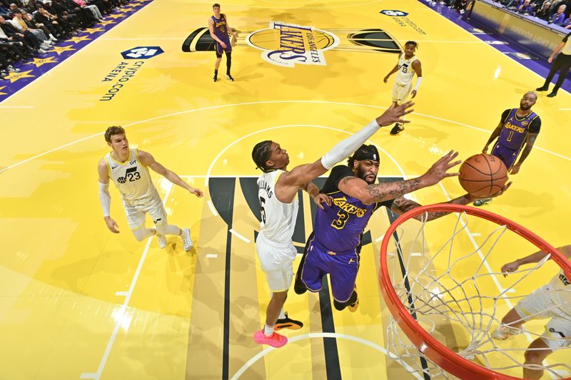 LOS ANGELES, CA - NOVEMBER 19: Anthony Davis #3 of the Los Angeles Lakers drives to the basket during the game against the Utah Jazz during the Emirates NBA Cup game on November 19, 2024 at Crypto.Com Arena in Los Angeles, California. NOTE TO USER: User expressly acknowledges and agrees that, by downloading and/or using this Photograph, user is consenting to the terms and conditions of the Getty Images License Agreement. Mandatory Copyright Notice: Copyright 2024 NBAE (Photo by Adam Pantozzi/NBAE via Getty Images)