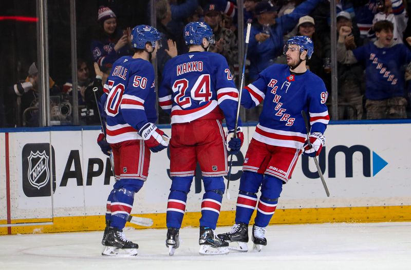 Nov 25, 2024; New York, New York, USA; New York Rangers left wing Will Cuylle (50) celebrates his goal with right wing Kaapo Kakko (24) and right wing Reilly Smith (91) during the first period against the St. Louis Blues at Madison Square Garden. Mandatory Credit: Danny Wild-Imagn Images