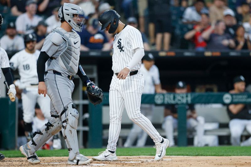 Jun 3, 2025; Chicago, Illinois, USA; Chicago White Sox first baseman Miguel Vargas (20) scores against the Detroit Tigers during the fourth inning at Rate Field. Mandatory Credit: Kamil Krzaczynski-Imagn Images