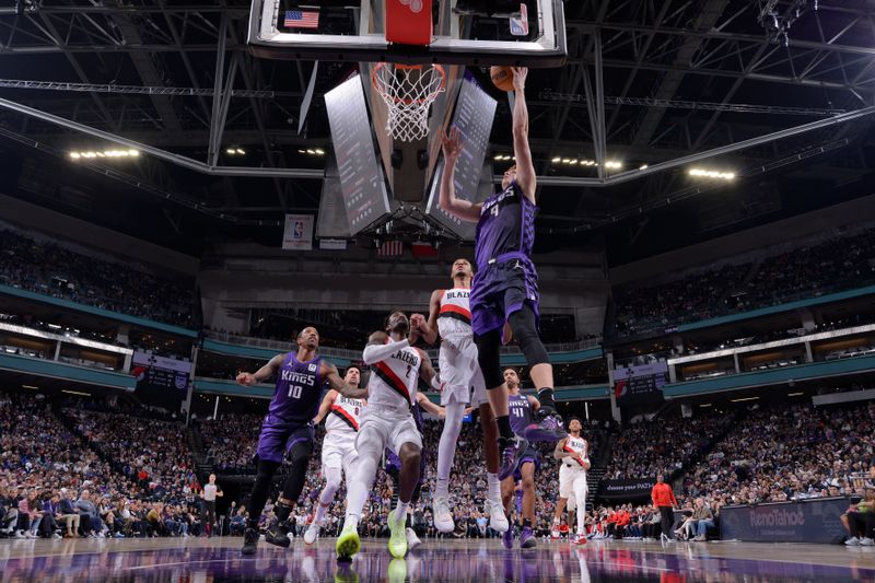 SACRAMENTO, CA - OCTOBER 28: Kevin Huerter #9 of the Sacramento Kings drives to the basket during the game against the Portland Trail Blazers on October 28, 2024 at Golden 1 Center in Sacramento, California. NOTE TO USER: User expressly acknowledges and agrees that, by downloading and or using this Photograph, user is consenting to the terms and conditions of the Getty Images License Agreement. Mandatory Copyright Notice: Copyright 2024 NBAE (Photo by Rocky Widner/NBAE via Getty Images)