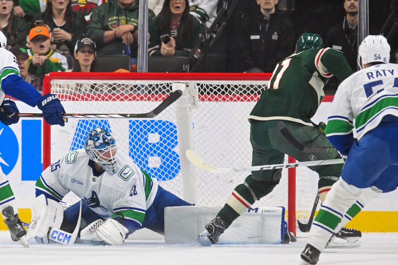 Nov 1, 2025; Saint Paul, Minnesota, USA;  Minnesota Wild forward Vladimir Tarasenko (91) beats Vancouver Canucks goalie Thatcher Demko (35) for a power play goal during the first period at Grand Casino Arena. Mandatory Credit: Nick Wosika-Imagn Images