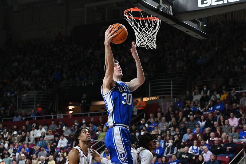 Jan 7, 2023; Chestnut Hill, Massachusetts, USA; Duke Blue Devils center Kyle Filipowski (30) attempts a layup against the Boston College Eagles during the second half at the Conte Forum. Mandatory Credit: Brian Fluharty-USA TODAY Sports