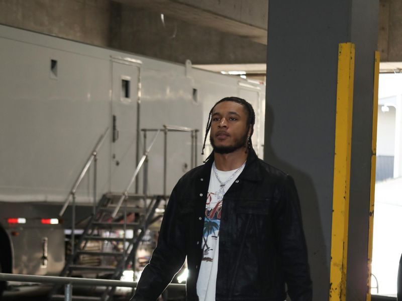 PORTLAND, OR - MARCH 8:  Cam Whitmore #7 of the Houston Rockets arrives to the arena before the game on March 8, 2024 at the Moda Center Arena in Portland, Oregon. NOTE TO USER: User expressly acknowledges and agrees that, by downloading and or using this photograph, user is consenting to the terms and conditions of the Getty Images License Agreement. Mandatory Copyright Notice: Copyright 2024 NBAE (Photo by Cameron Browne/NBAE via Getty Images)