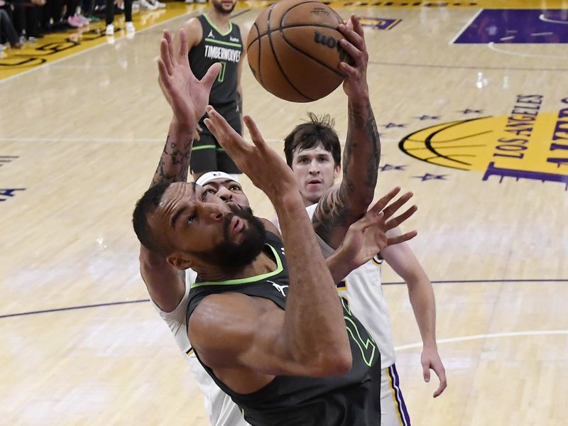 LOS ANGELES, CALIFORNIA - APRIL 7: Anthony Davis #3 of the Los Angeles Lakers steals the ball from Rudy Gobert #27 of the Minnesota Timberwolves during the first half at Crypto.com Arena on April 7, 2024 in Los Angeles, California. NOTE TO USER: User expressly acknowledges and agrees that, by downloading and or using this photograph, User is consenting to the terms and conditions of the Getty Images License Agreement. (Photo by Kevork Djansezian/Getty Images)