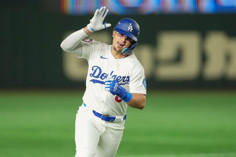 Mar 19, 2025; Bunkyo, Tokyo, JPN; Los Angeles Dodgers third baseman Enrique Hernández (8) rounds the bases after hitting a home run in the fourth inning against the Chicago Cubs during the Tokyo Series at Tokyo Dome. Mandatory Credit: Darren Yamashita-Imagn Images