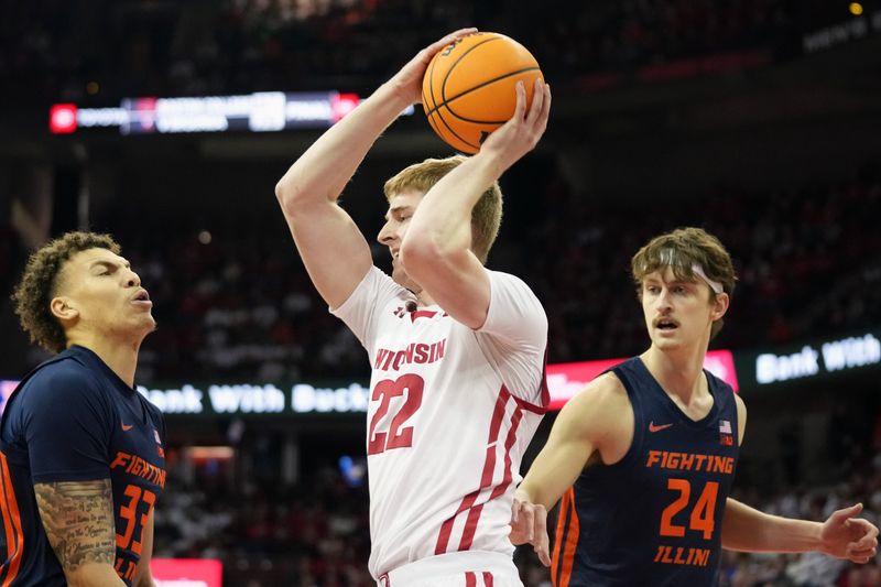 Jan 28, 2023; Madison, Wisconsin, USA;  Wisconsin Badgers forward Steven Crowl (22) rebounds the ball under coverage by Illinois Fighting Illini forward Coleman Hawkins (33) and Illinois Fighting Illini forward Matthew Mayer (24) during the first half at the Kohl Center. Mandatory Credit: Kayla Wolf-USA TODAY Sports