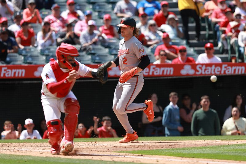 Apr 24, 2024; Anaheim, California, USA;  Baltimore Orioles shortstop Gunnar Henderson (2) scores a run on RBI single by designated hitter Adley Rutschman (not pictured) during the fifth inning against the Los Angeles Angels at Angel Stadium. Mandatory Credit: Kiyoshi Mio-USA TODAY Sports