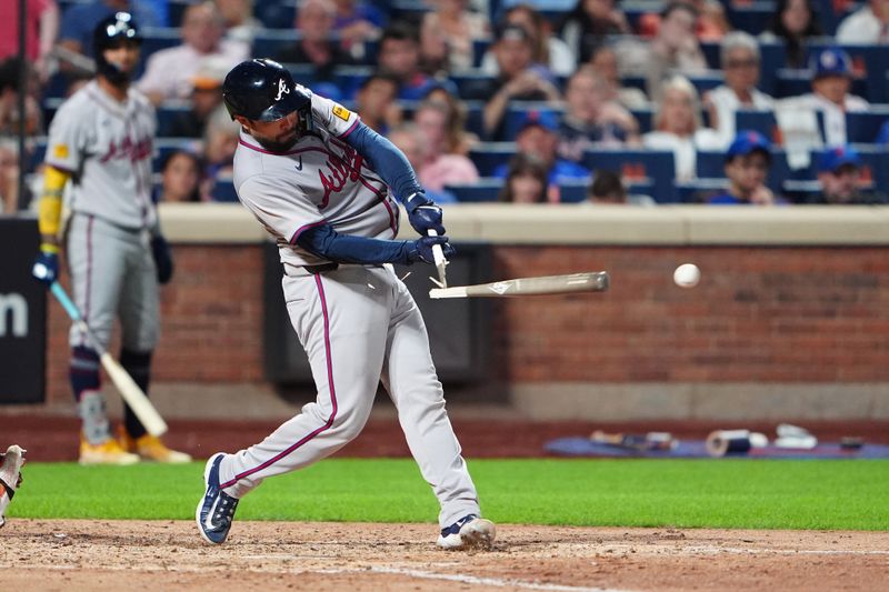 Jul 25, 2024; New York City, New York, USA; Atlanta Braves catcher Travis d'Arnaud (16) hits a broken bat RBI single against the New York Mets during the sixth inning at Citi Field. Mandatory Credit: Gregory Fisher-USA TODAY Sports