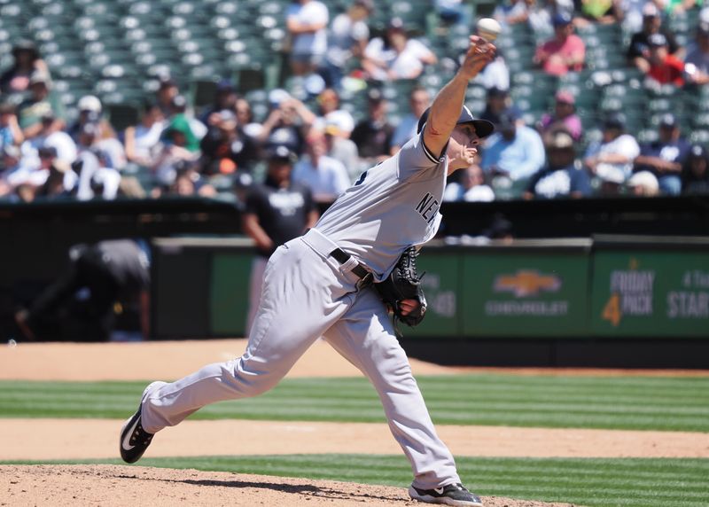 Jun 29, 2023; Oakland, California, USA; New York Yankees relief pitcher Ian Hamilton (71) pitches the ball against the Oakland Athletics during the sixth inning at Oakland-Alameda County Coliseum. Mandatory Credit: Kelley L Cox-USA TODAY Sports