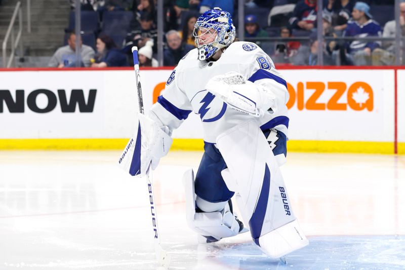 Jan 2, 2024; Winnipeg, Manitoba, CAN; Tampa Bay Lightning goaltender Andrei Vasilevskiy (88) warms up prior to the start of the second period against the Winnipeg Jets at Canada Life Centre. Mandatory Credit: James Carey Lauder-USA TODAY Sports