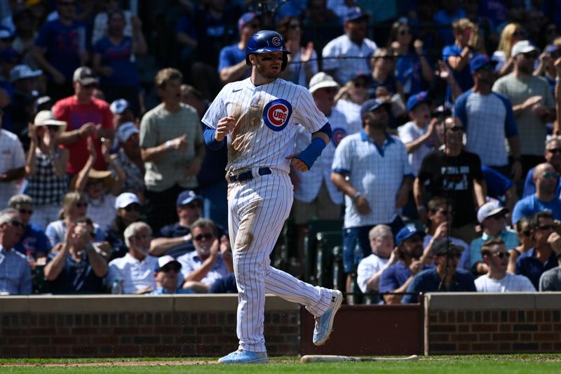 Sep 6, 2023; Chicago, Illinois, USA;  Chicago Cubs left fielder Ian Happ (8) scores against the San Francisco Giants during the third inning at Wrigley Field. Mandatory Credit: Matt Marton-USA TODAY Sports