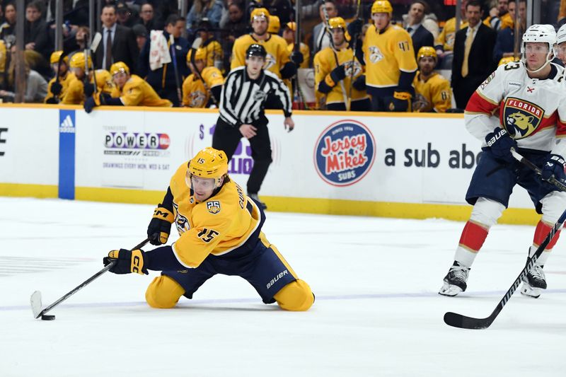 Jan 22, 2024; Nashville, Tennessee, USA; Nashville Predators right wing Denis Gurianov (15) tries to keep the puck onside during the third period against the Florida Panthers at Bridgestone Arena. Mandatory Credit: Christopher Hanewinckel-USA TODAY Sports