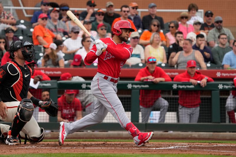 Feb 26, 2024; Scottsdale, Arizona, USA; Los Angeles Angels left fielder Jason Martin (51) hits an RBI single against the San Francisco Giants in the first inning at Scottsdale Stadium. Mandatory Credit: Rick Scuteri-USA TODAY Sports