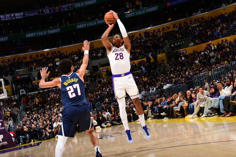 LOS ANGELES, CA - NOVEMBER 23: Rui Hachimura #28 of the Los Angeles Lakers shoots the ball during the game against the Denver Nuggets on November 23, 2024 at Crypto.Com Arena in Los Angeles, California. NOTE TO USER: User expressly acknowledges and agrees that, by downloading and/or using this Photograph, user is consenting to the terms and conditions of the Getty Images License Agreement. Mandatory Copyright Notice: Copyright 2024 NBAE (Photo by Adam Pantozzi/NBAE via Getty Images)